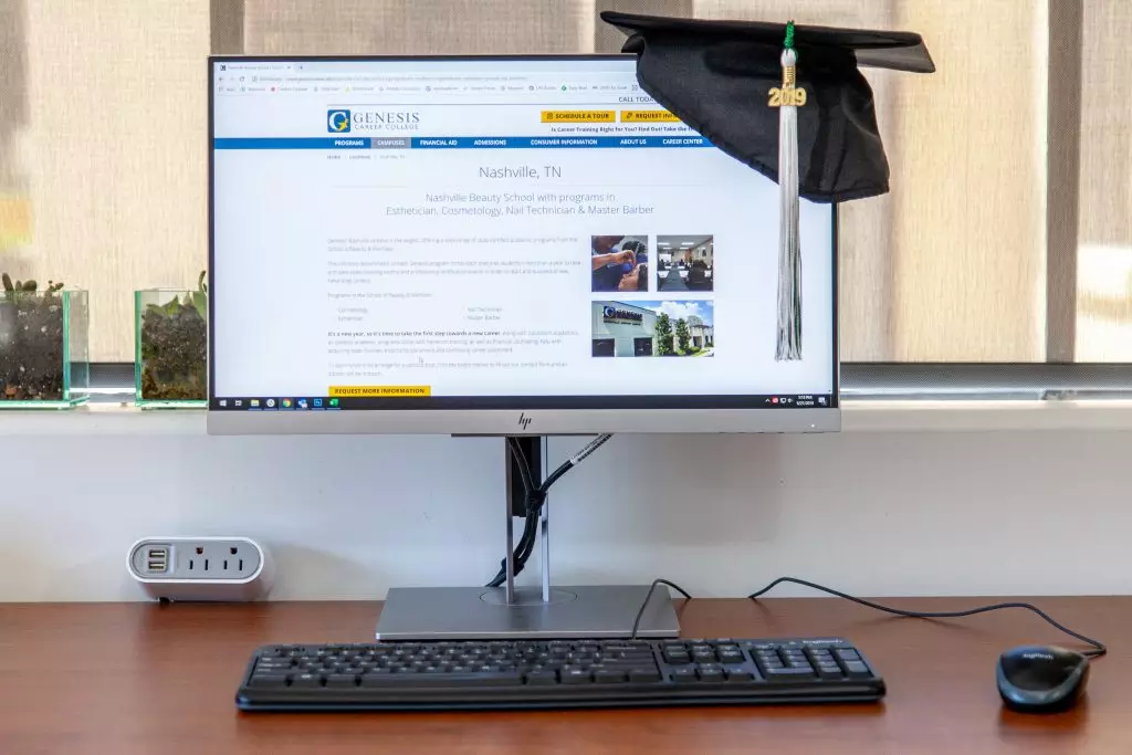 computer with graduation cap on it