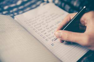 hand writing on notebook filled with graph paper