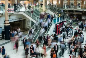 busy bus station with blurry people moving around