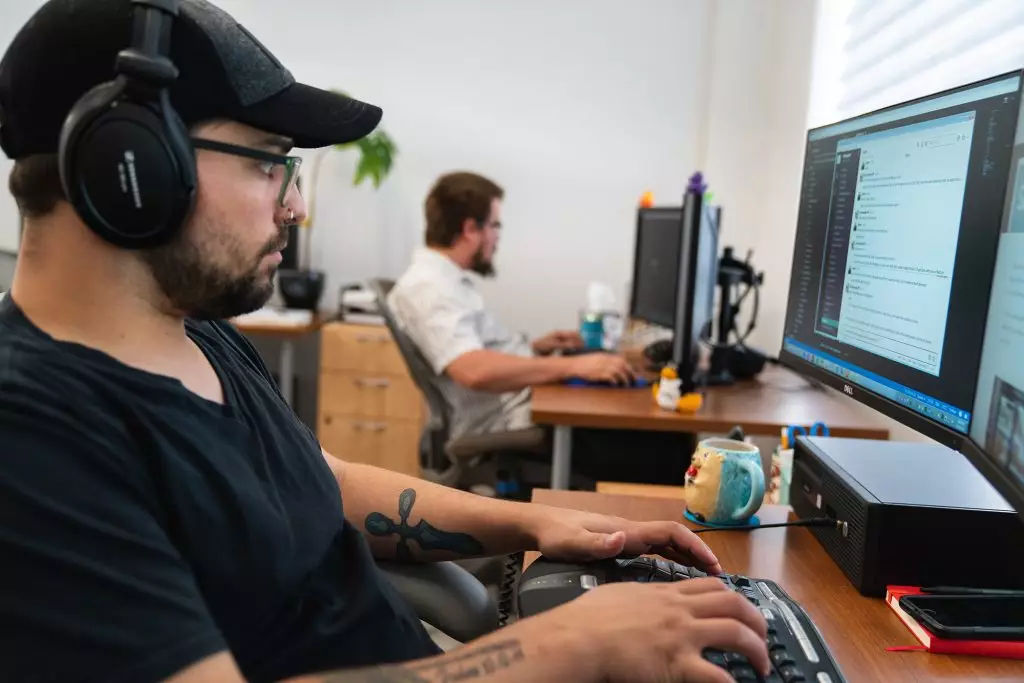 jd antosiak coding at his desk