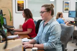 Professional content marketer working a computer.