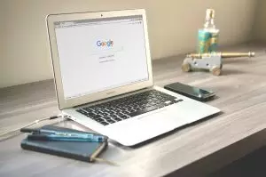 laptop on desk with google open on screen