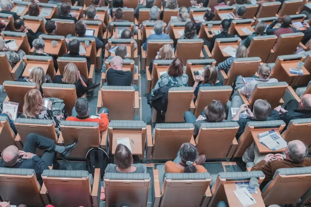 auditorium filled with seated people