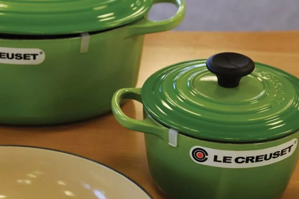 A set of Le Creuset enamel cookware on a countertop