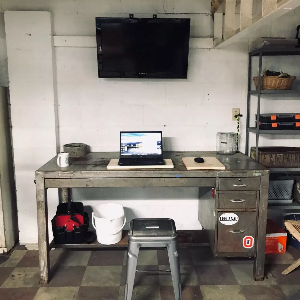 oneupweb director of content marketing and seo freddy hunt's desk at his home in the garage. he called it the garoffice