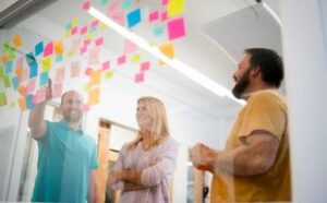 Creative workers planning a project with sticky notes